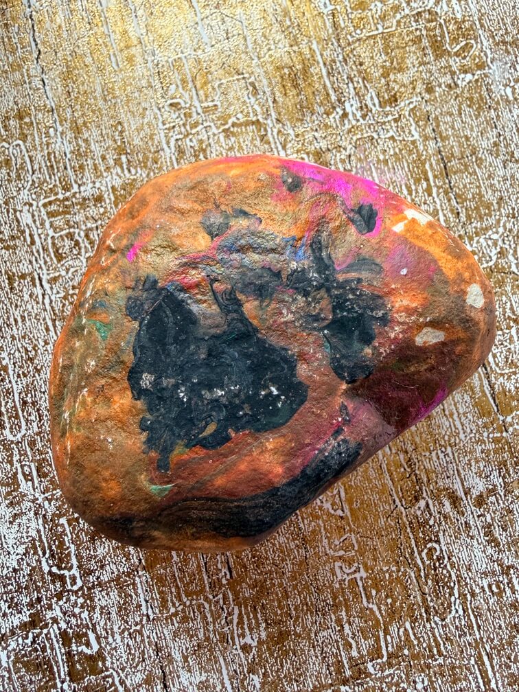 Painted stone No. 1, decorated in brown, black and pink