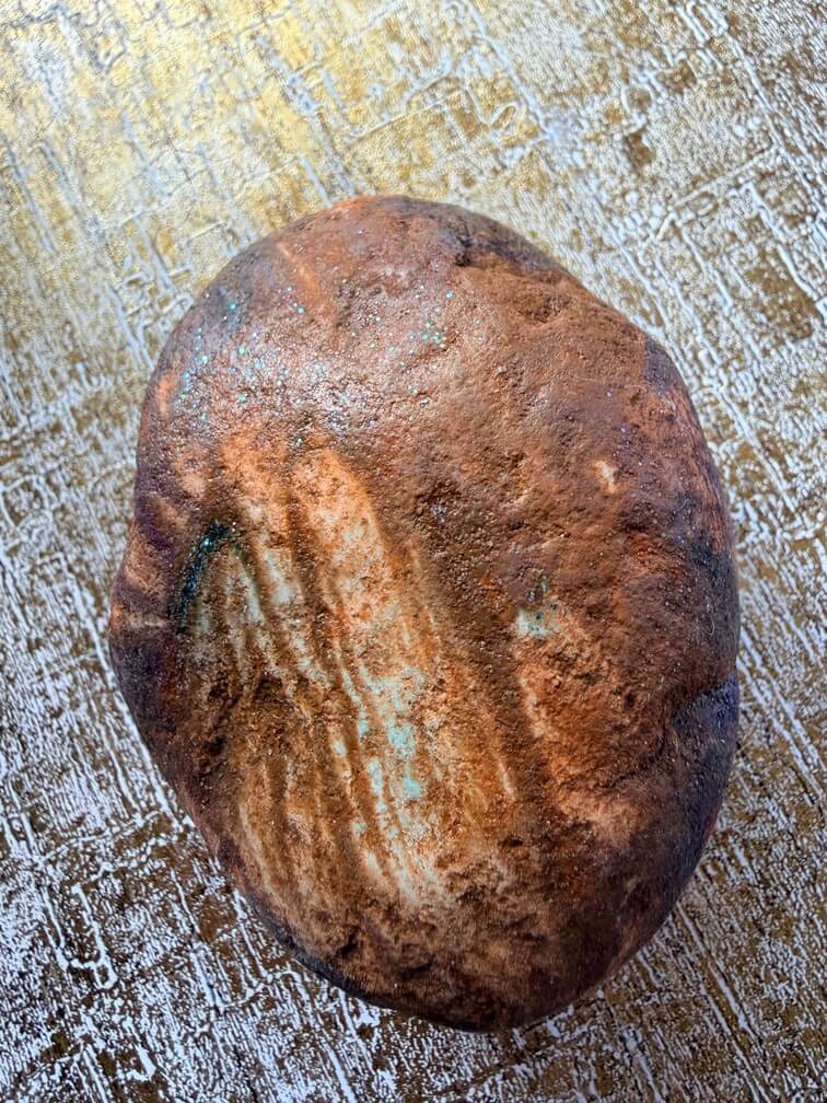 Painted stone No. 4, decorated as: Brown, finger paint, Sparkles