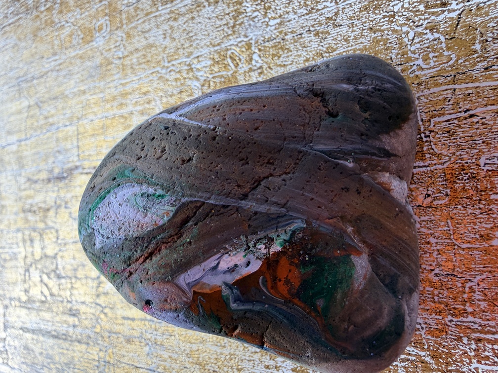 Painted stone No. 10, decorated as: Triangle grey, orange, white