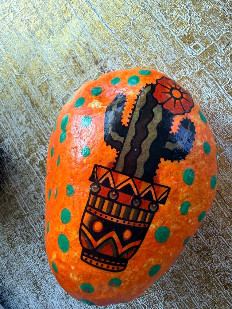 Painted stone No. 13, decorated as: Orange cactus