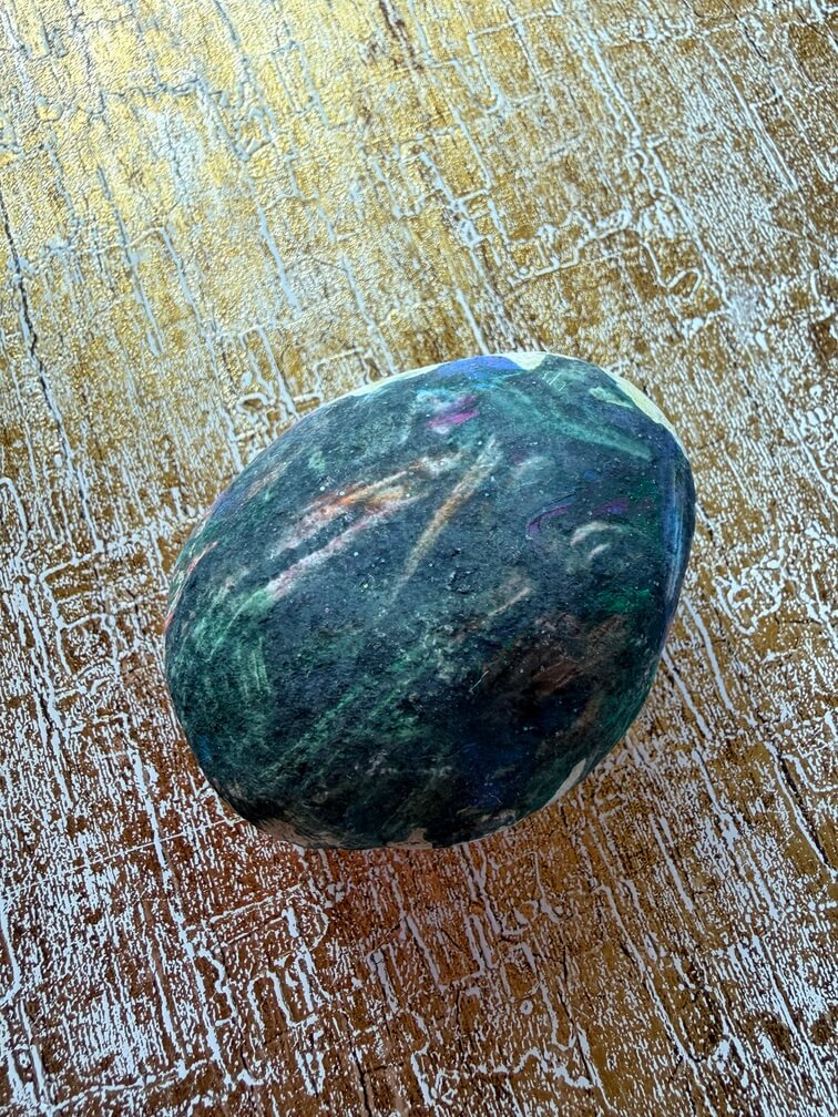 Painted stone No. 20, decorated as: Blacky/Greeny/Liney, blue dot with sparkle