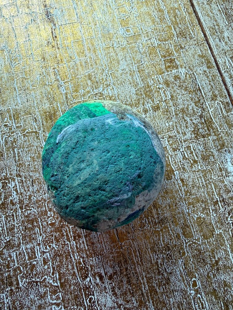 Painted stone No. 23, decorated as: Green under whitey green and J shape