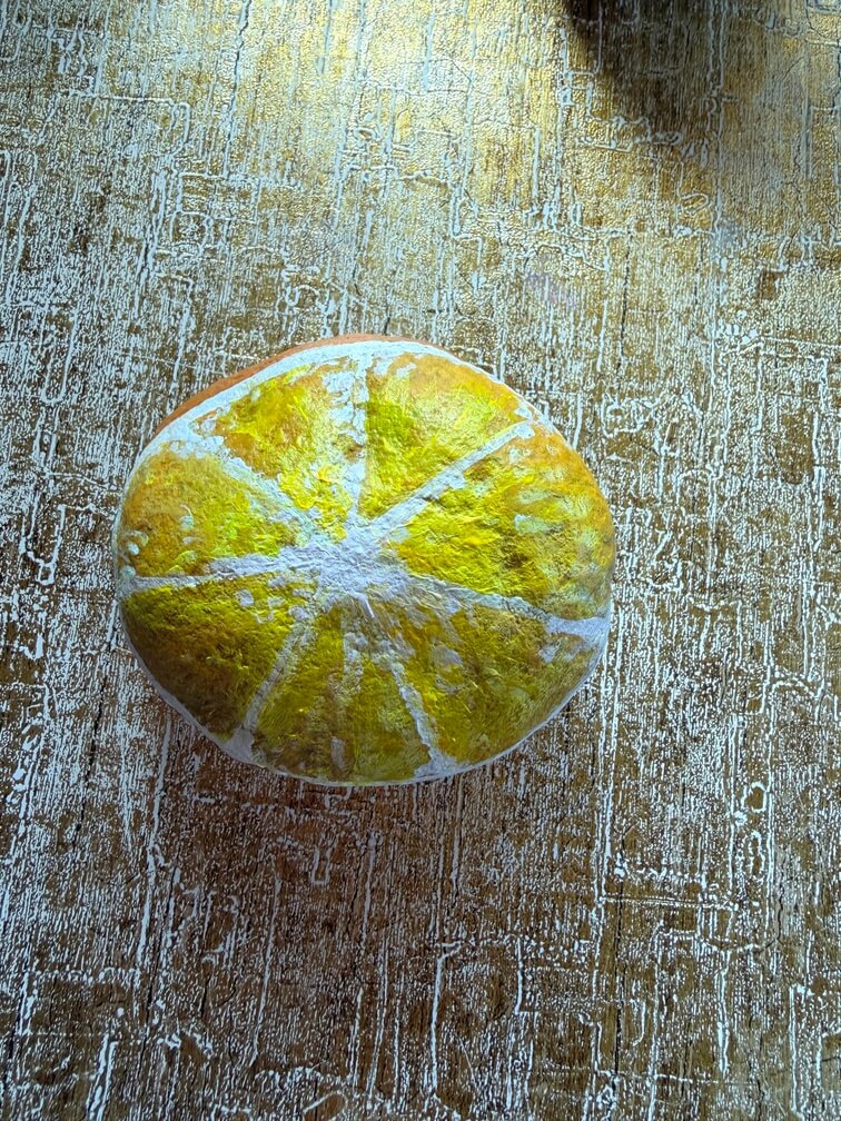 Painted stone No. 29, decorated as: Orange fruit