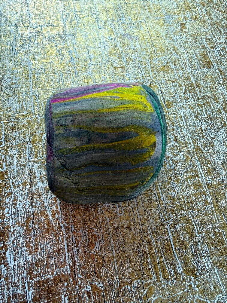 Painted stone No. 41, decorated as: Ramp shaped yellow lines