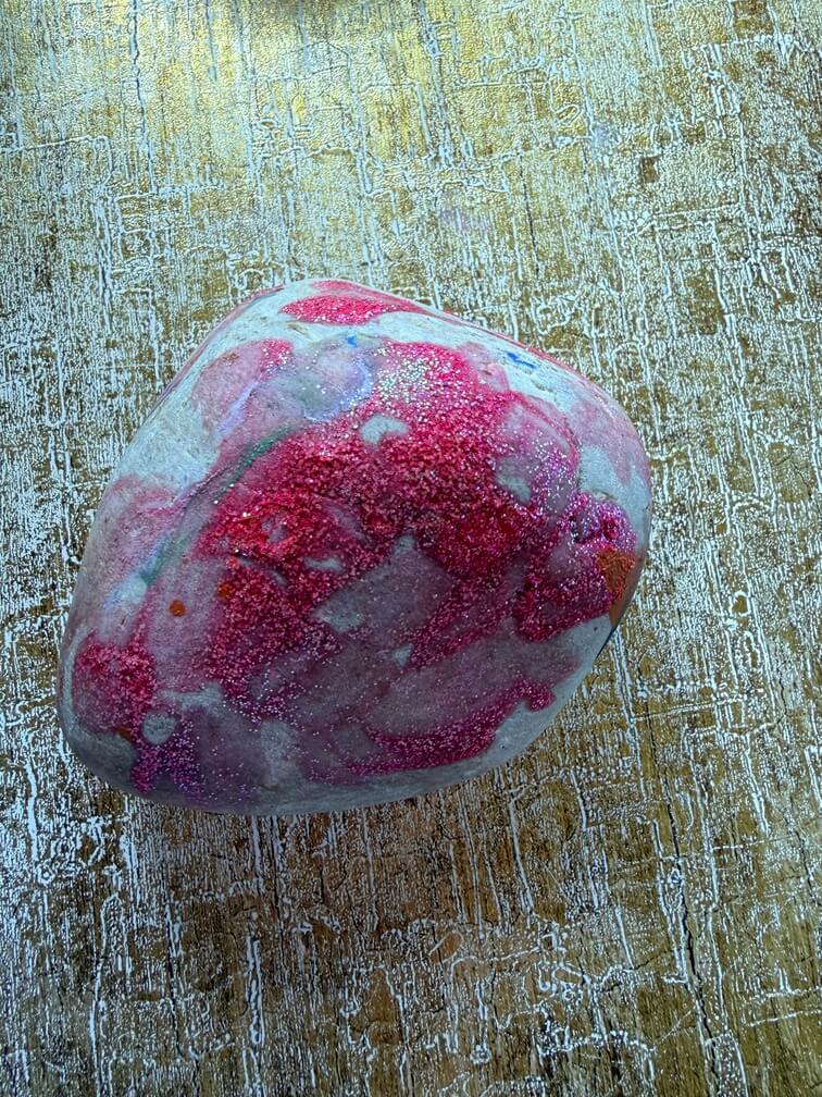 Painted stone No. 44, decorated as: Big sparkle pink