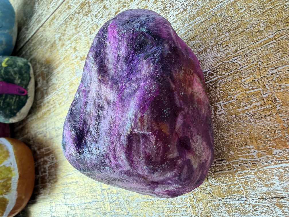 Painted stone No. 53, decorated as: Pink and black galaxy