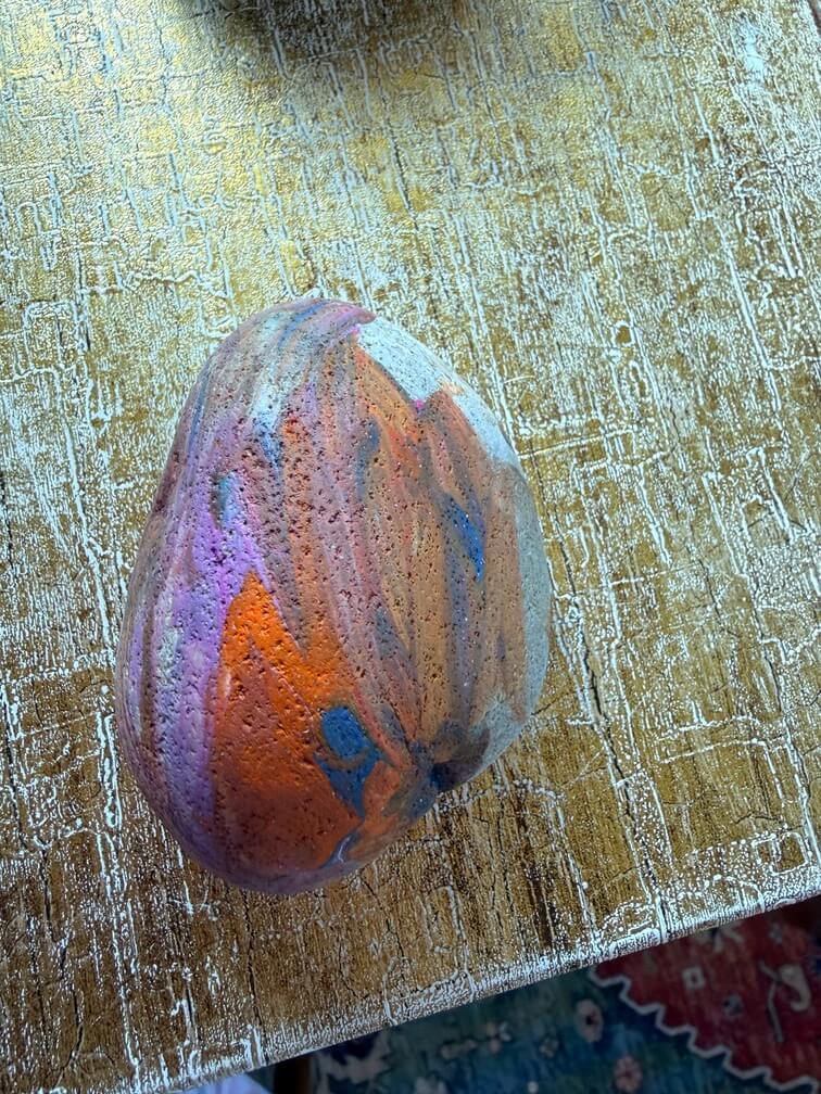 Painted stone No. 60, decorated as: Pink, orange, brown